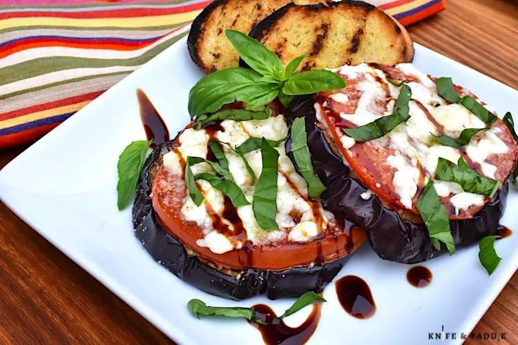 Grilled Eggplant Parmesan Stacks with balsamic glaze and fresh basil topped with mozzarella and parmesan