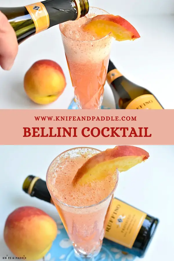 Refreshing Bellini Cocktail with a peach wedge in a Champagne glass