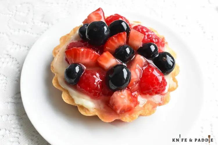 Strawberries, Raspberries and Blueberries atop a sweet cream pastry