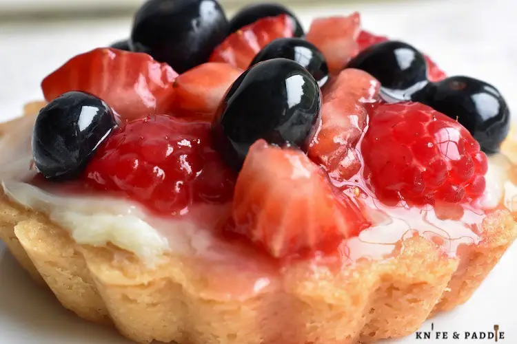 Fresh strawberry, blueberry and raspberry dessert with a sweet pastry crust and cream cheese filling