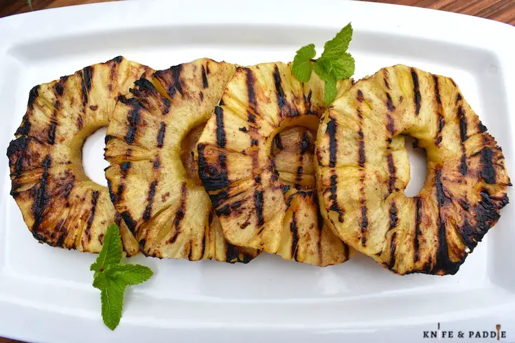 Grilled pineapple rings on a plate