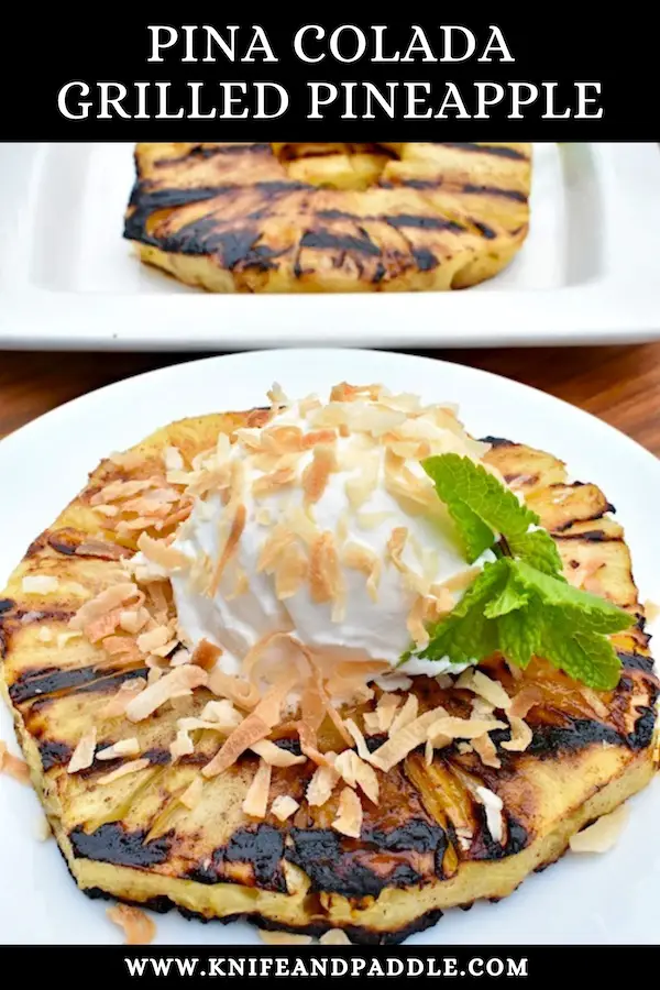 Piña Colada Grilled Pineapple on a plate with coconut whipped topping and toasted shredded coconut 