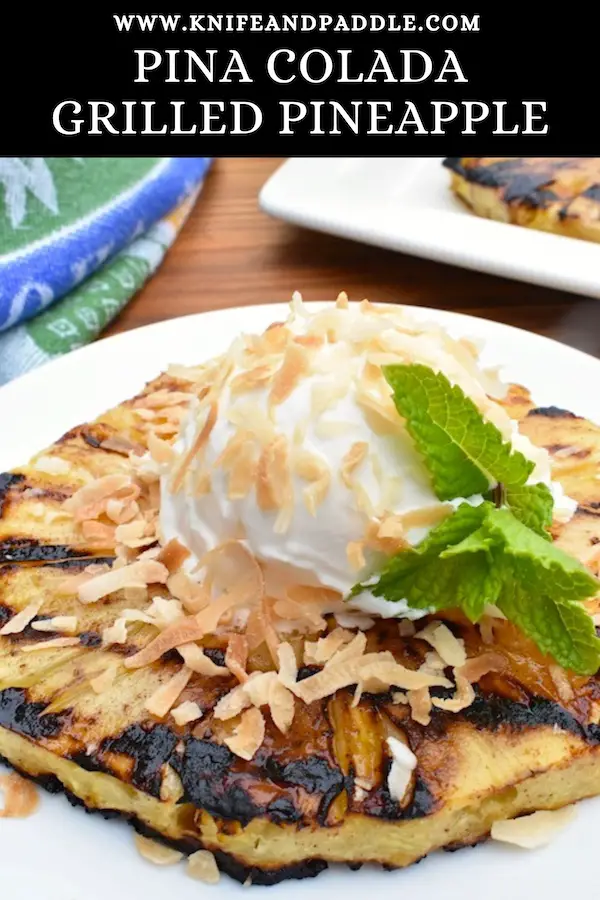 Caramelized fruit on a platter with coconut whipped topping and toasted shredded coconut