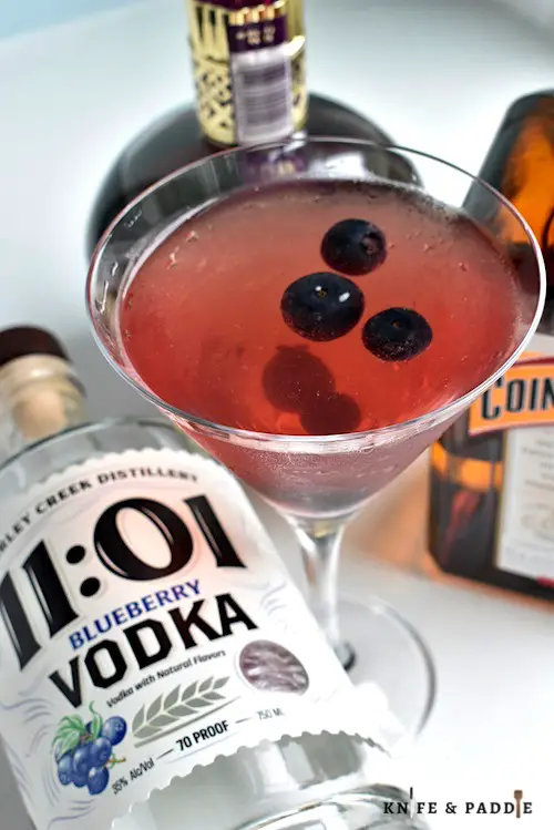 Blueberry Cosmopolitan garnished with fresh blueberries