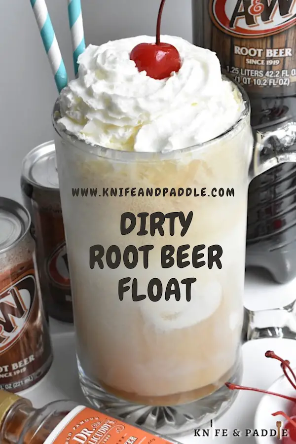 Dirty Root Beer Float topped with whipped cream and a maraschino cherry