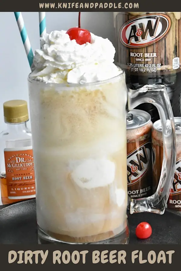 Dirty Root Beer Float topped with whipped cream and a maraschino cherry