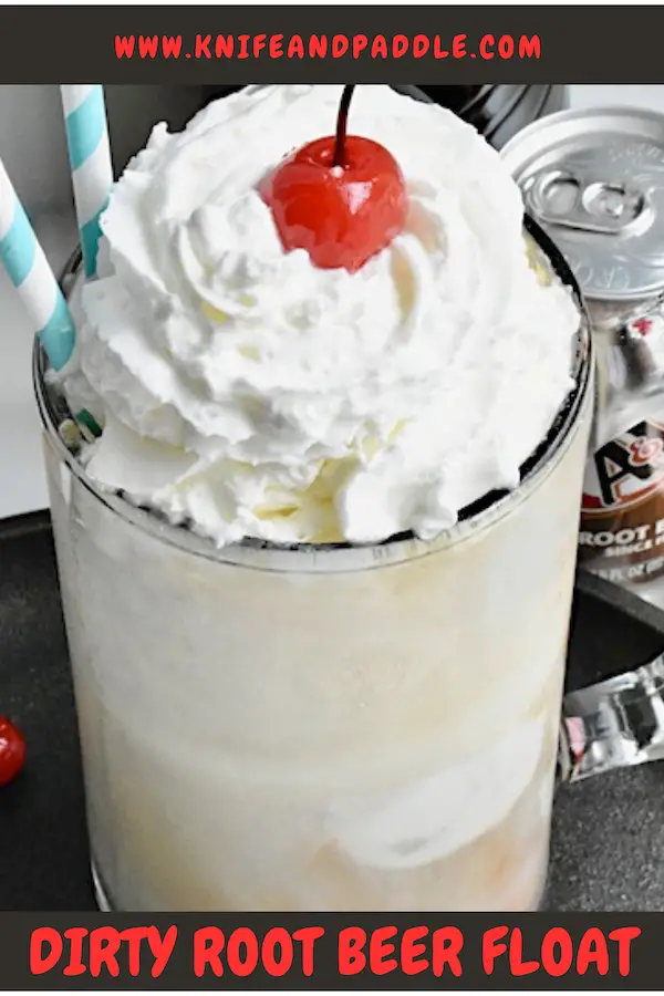 Dirty Root Beer Float topped with whipped cream and a maraschino cherry