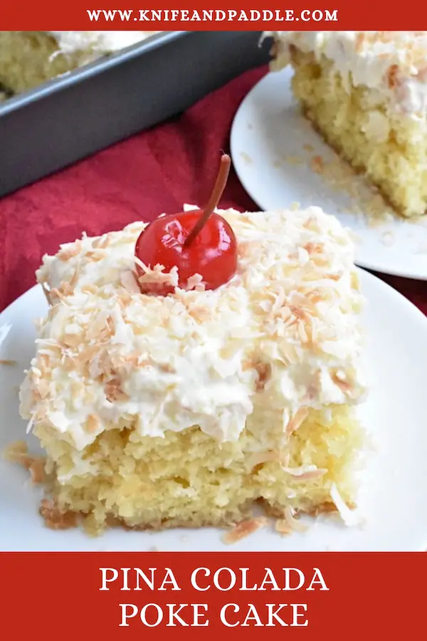 Slices of Pina Colada Poke Cake on  plates topped with whipped topping, toasted coconut and a maraschino cherry