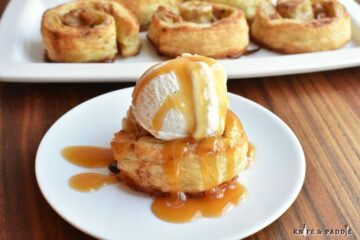 Apple Pinwheels topped with vanilla ice cream and caramel sauce