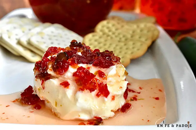 Chili peppers poured over cream cheese and served with an assortment of crackers