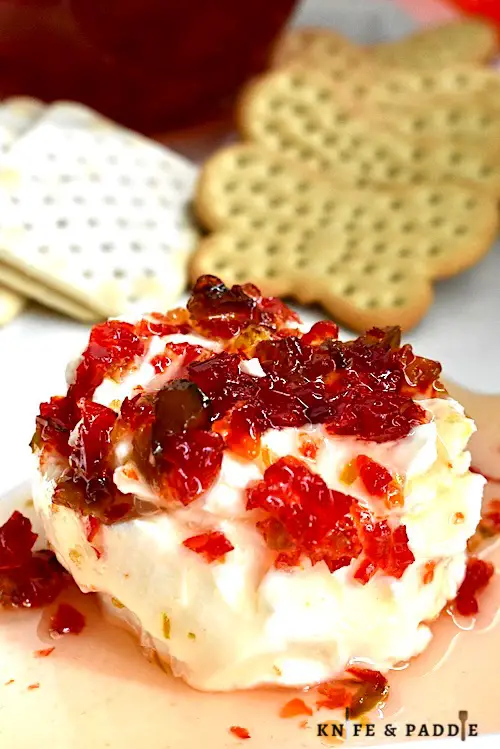 Chili peppers poured over cream cheese and served with an assortment of crackers