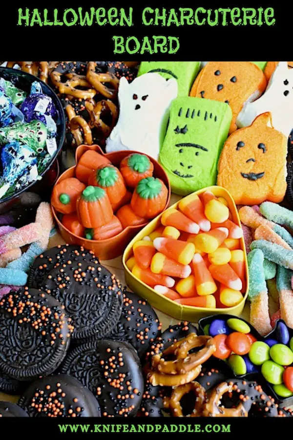 Ghost, Frankenstein and Pumpkin Pepps, Pretzels, Candy Corn, Pumpkin Candy Corn, Gummy worms, M&M's, Oreos, Hershey's Kisses arranged on a platter