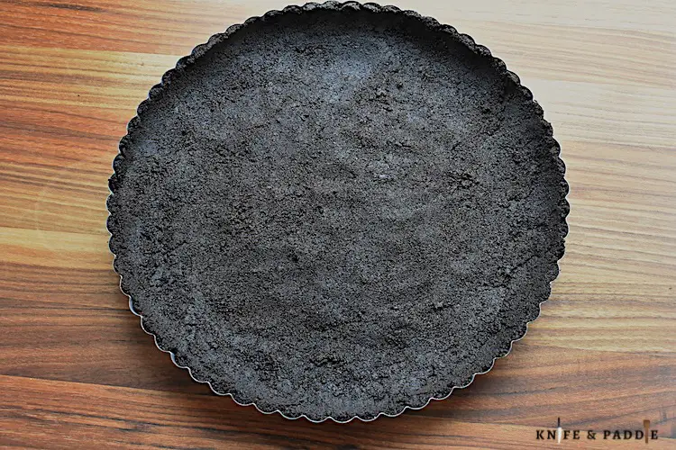 No-bake Oreo crust pressed into a tart pan