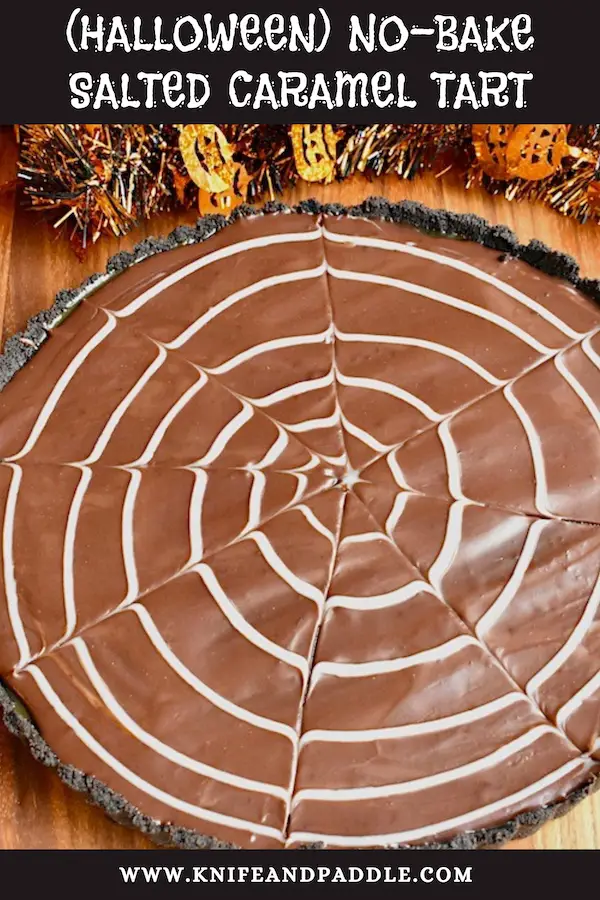 Halloween No-Bake Salted Caramel Tart with an Oreo crust and a white chocolate spider web ganache