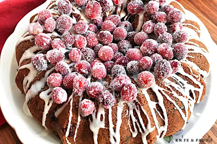 Cranberry Bundt Cake with a glaze drizzle and sugared cranberries