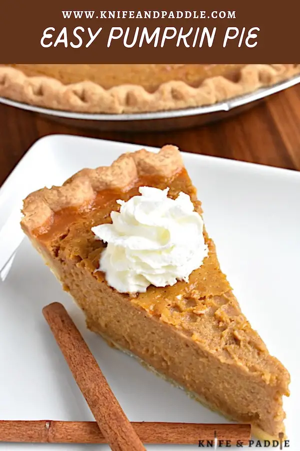 Easy Pumpkin Pie on a plate topped with whipped cream