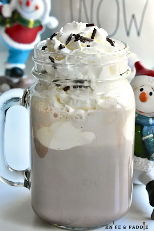 Drunken Snowman Cocktail with Whipped Cream and Chocolate Sprinkles