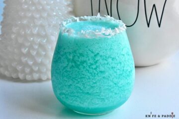 Jack Frost Cocktail with a shredded coconut rim