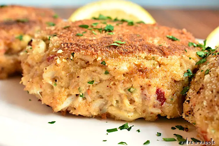 Easy Crab Cakes on a dish with a fresh lemon wedge