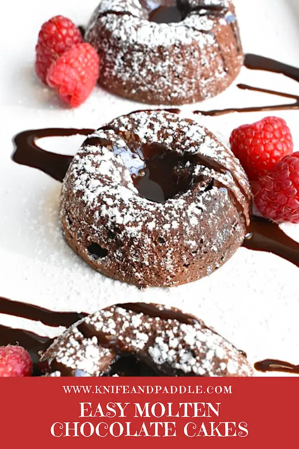 Easy Molten Chocolate Cake with chocolate sauce, raspberries and vanilla ice cream