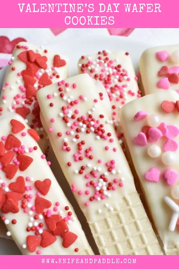 Valentine's Day Wafer Cookies topped with red and pink hearts and sprinkles