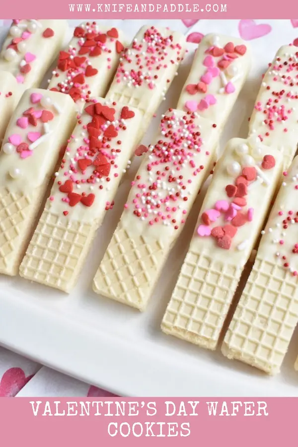 Valentine's Day Wafer Cookies topped with red and pink hearts and sprinkles