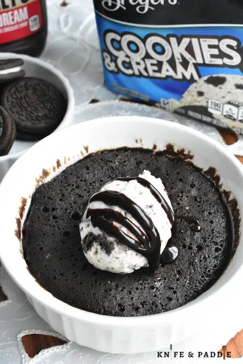 2-Minute Oreo Cake topped with cookies and cream ice cream and chocolate sauce